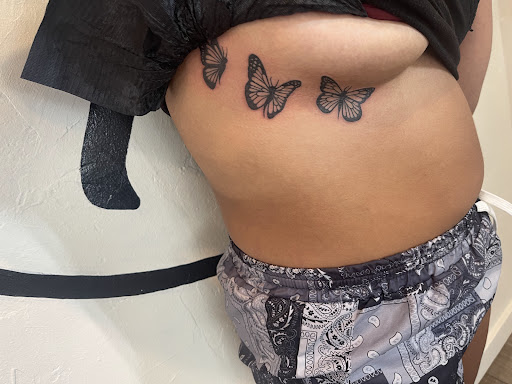 Explore leg tattoo ideas for females, creative tattoo ideas in Avon, available at Avanti Tattoo