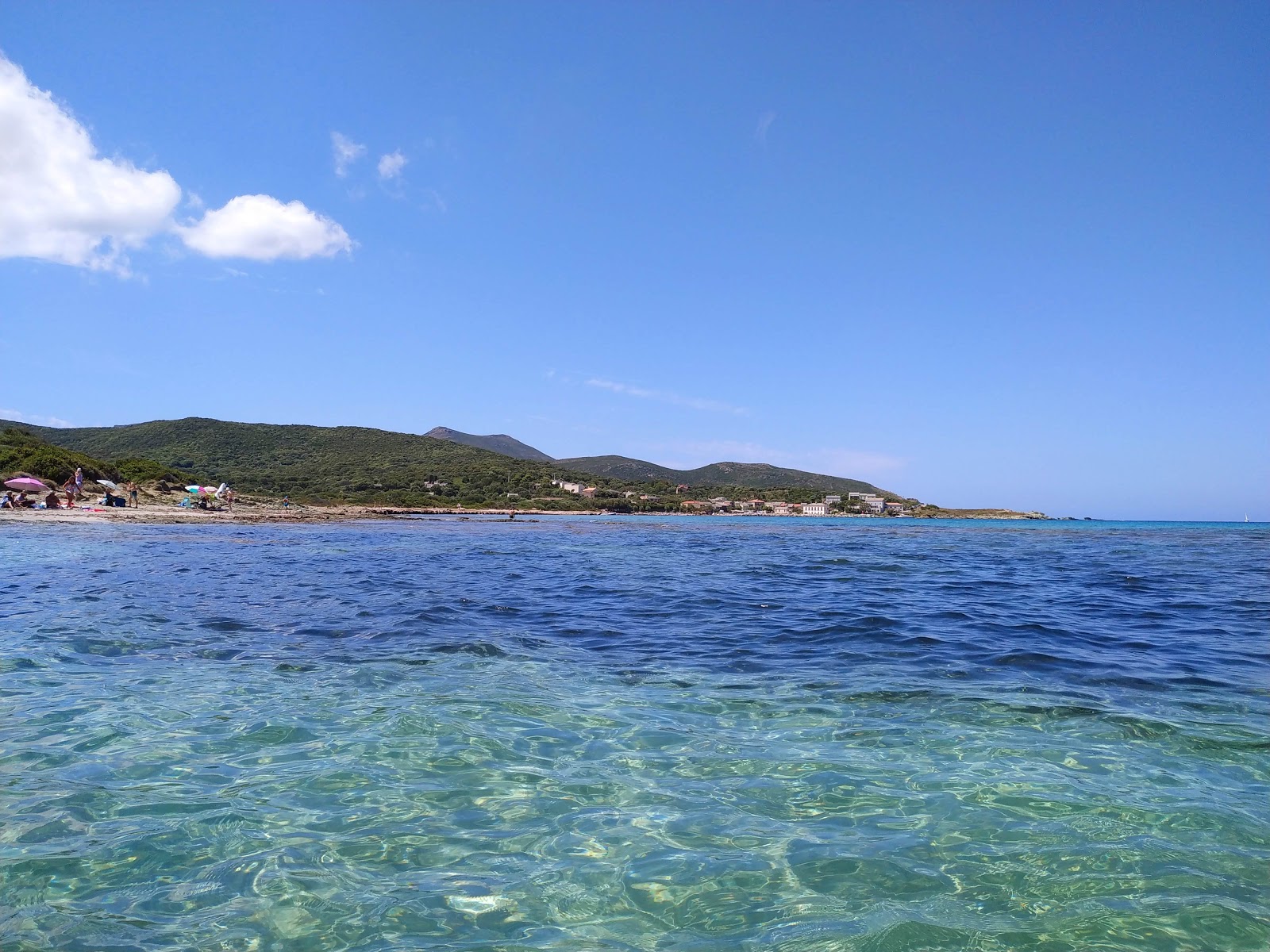 Foto van Barcaggio beach met turquoise puur water oppervlakte