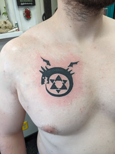 Explore animal tattoo ideas for men, creative tattoo ideas in Slippery Rock, available at Dinky Dachshund Tattoo Parlor