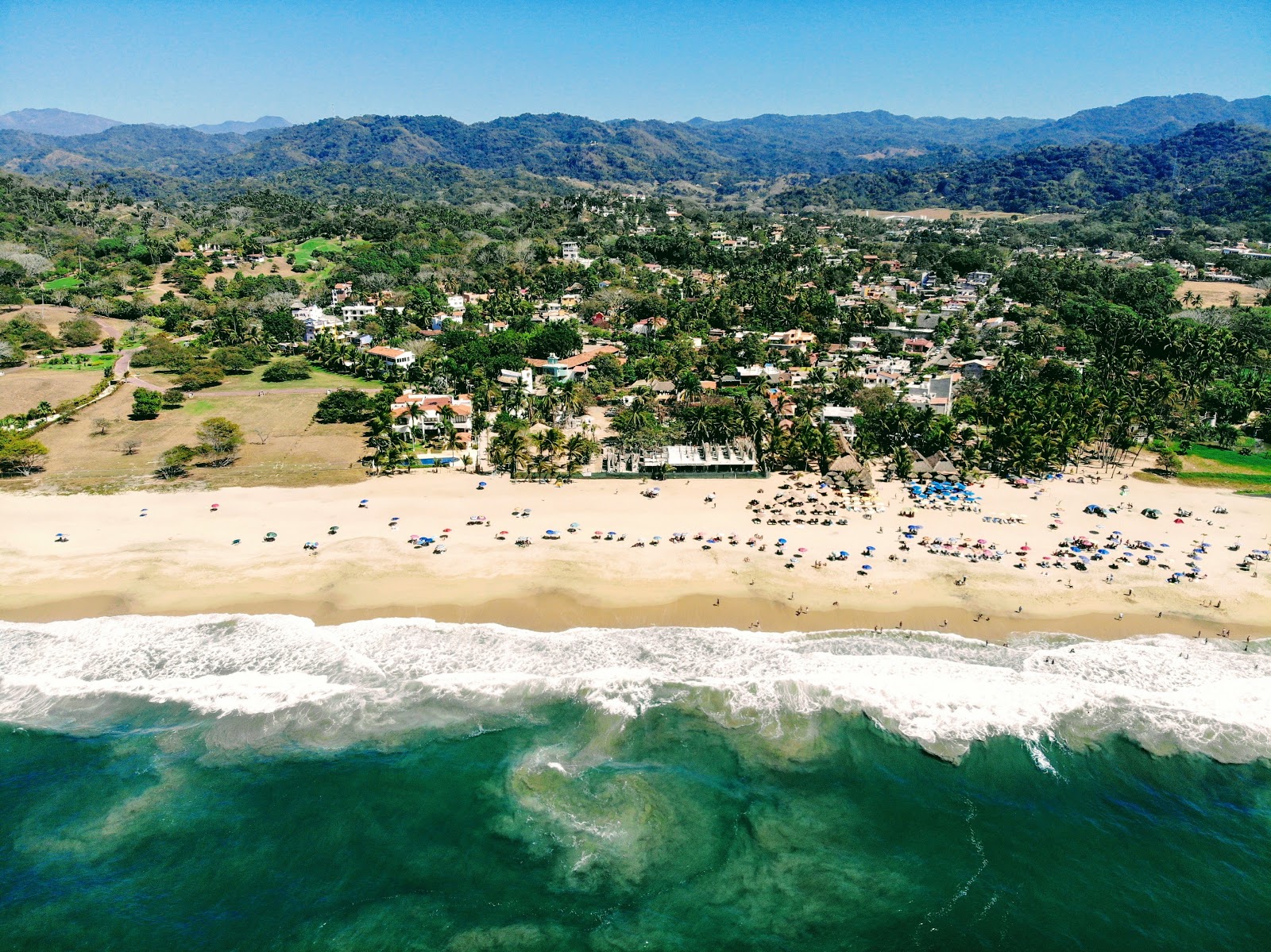 Foto van San Pancho beach met recht en lang