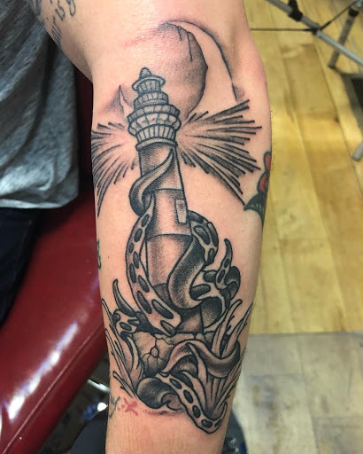 Explore lily flower tattoo ideas, creative tattoo ideas in Milwaukee, available at Mike Davenport Tattoo