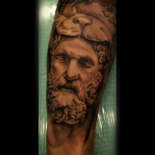 Explore hood tattoo ideas, creative tattoo ideas in Colorado Springs, available at Empire Tattoo Co.