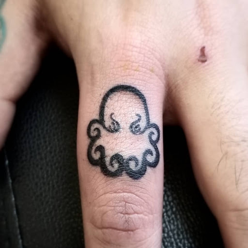 Explore five finger death punch tattoo ideas, creative tattoo ideas in Caldwell, available at Blue Ring Studio Tattoo & Piercing