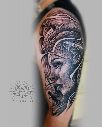 Explore fighting tattoo ideas, creative tattoo ideas in Streator, available at Ink Beetle Tattoo