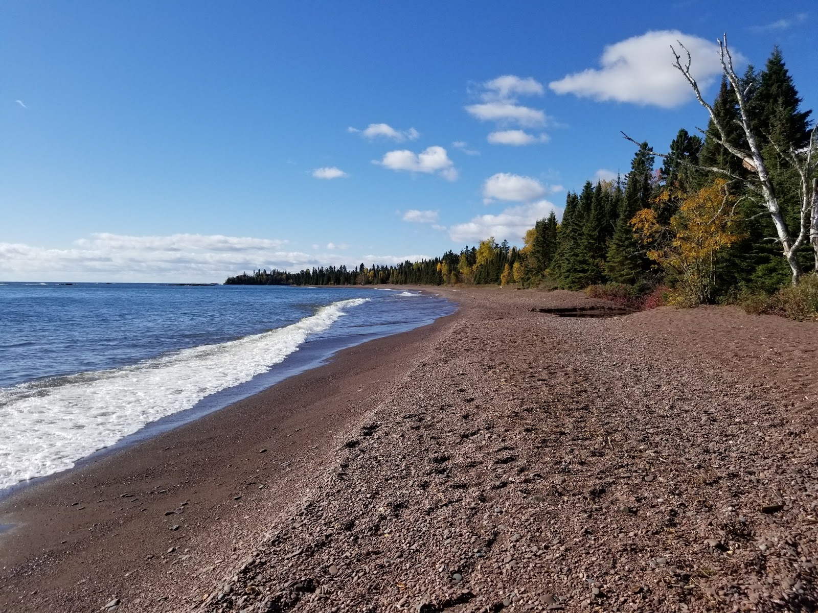 Foto av Paradise Beach med sand med stenar yta