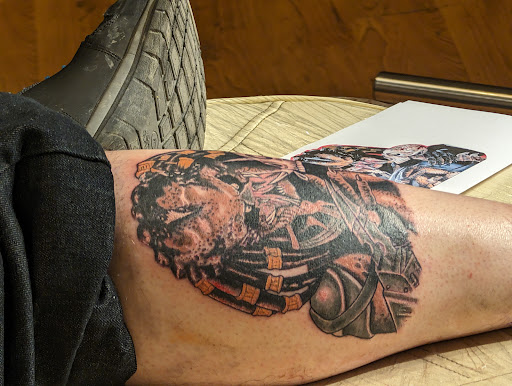 Explore blackout sleeve tattoo ideas, creative tattoo ideas in Owosso, available at Crimson Tattoos