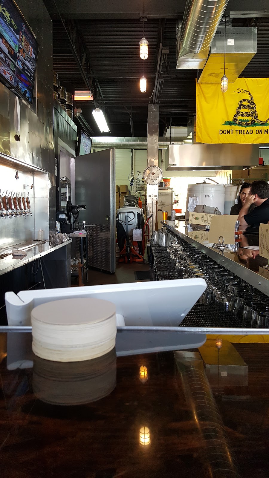 Beer taps lined up on a bar