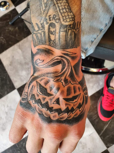 Explore marriage ring tattoo ideas, creative tattoo ideas in Independence, available at Time Machine Tattoo