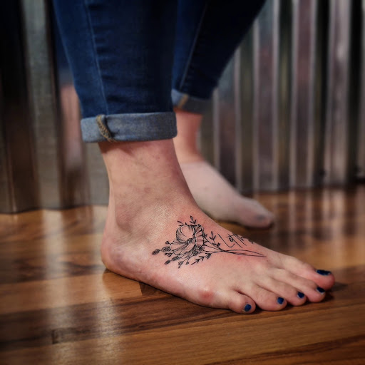 Explore small bum tattoo ideas for females, creative tattoo ideas in Minocqua, available at Whisky Rose Tattoo Parlor