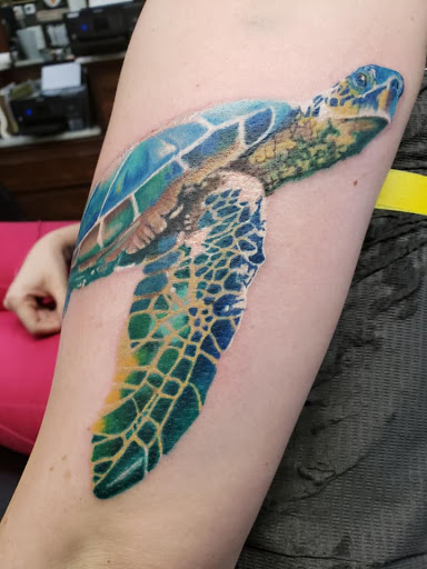 Explore book tattoos ideas, creative tattoo ideas in Crownsville, available at DreamWorks Tattoo LLC