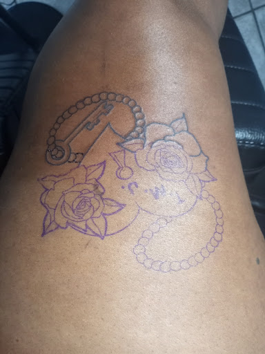 Explore last name back tattoo ideas, creative tattoo ideas in Warren, available at Dark Horse Tattoo Co. LLC.