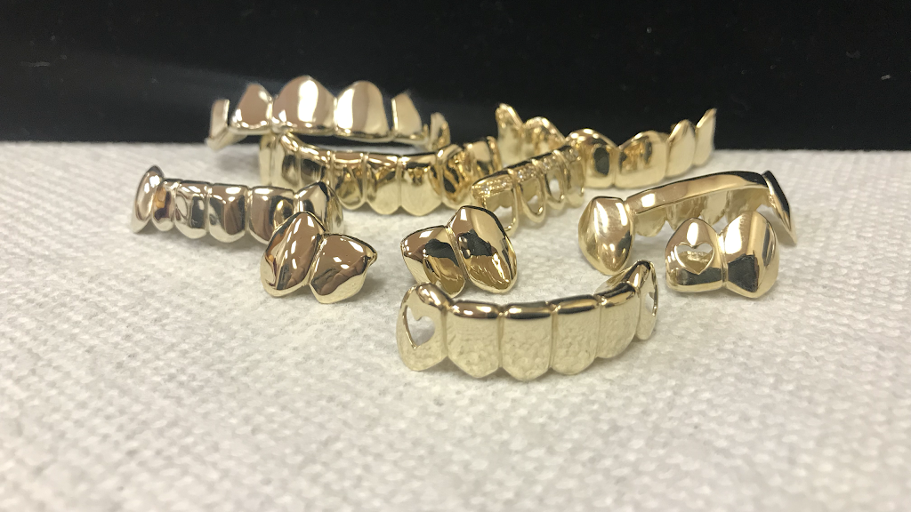 Royal bling jewelry Gold teeth grillz specialists Oakland, CA 94612