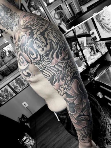 Explore partial sleeve tattoo ideas, creative tattoo ideas in Denver, available at Mantra Tattoo and Piercing