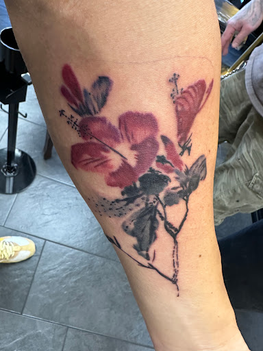 Explore koi fish sleeve tattoo ideas, creative tattoo ideas in West Chester, available at Conquest Tattoo