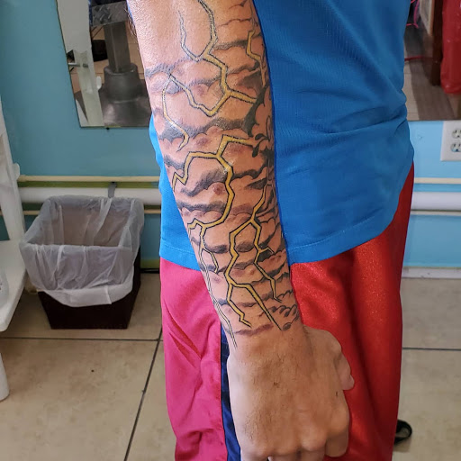 Explore lower sleeve tattoo ideas, creative tattoo ideas in Englewood, available at The Original Big Daddy Tattoo & Body Piercing est.1997 est.1997