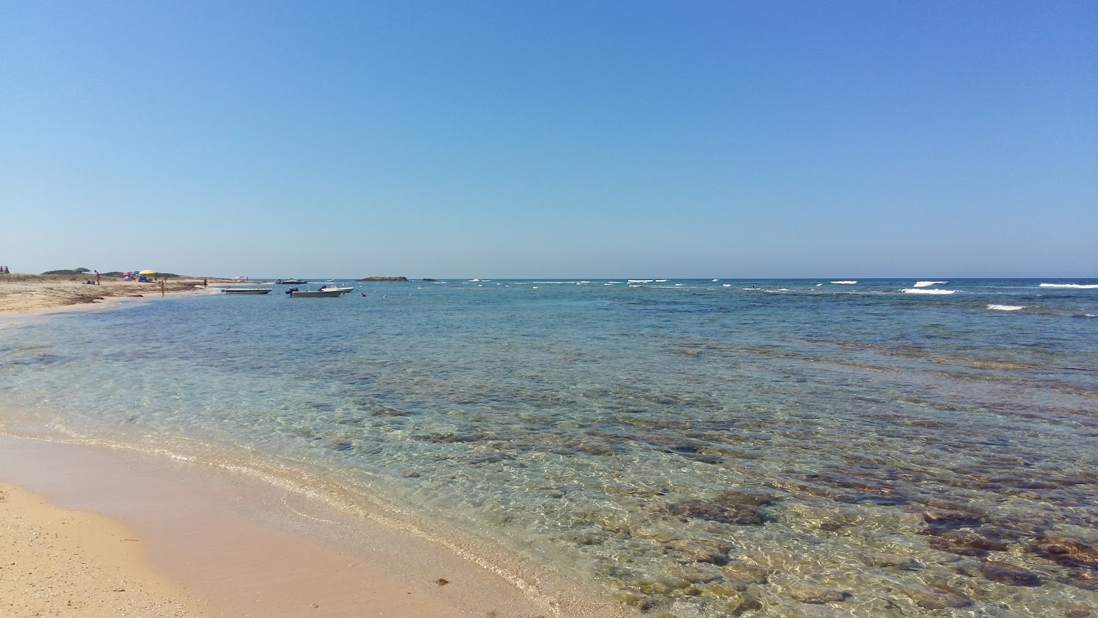 Foto van Spiaggia di Portu S'Uedda met turquoise puur water oppervlakte