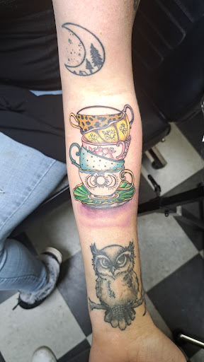 Explore house of the dragon tattoo ideas, creative tattoo ideas in Medina, available at Art In Motion Inc Tattooing