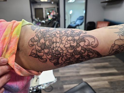 Explore roman numeral birthday tattoo ideas, creative tattoo ideas in Meadville, available at Lucky Lucys Tattoo and Art Studio