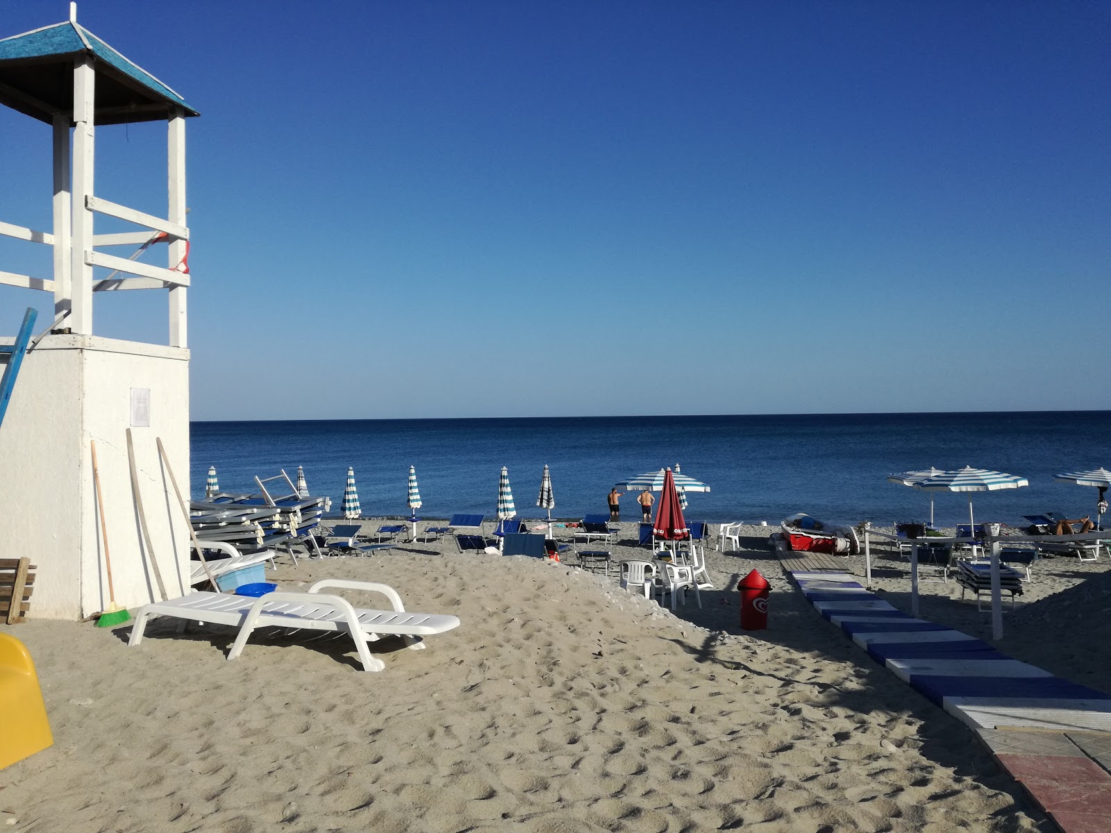 Foto van Portigliola's Beach met blauw water oppervlakte