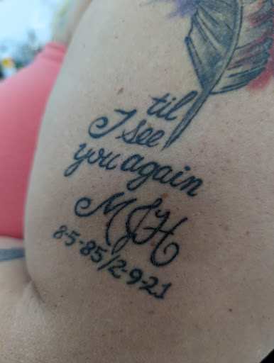 Explore cross cover up tattoo ideas, creative tattoo ideas in Grand Rapids, available at Screaming Needle Tattoo & Body Piercing Studios