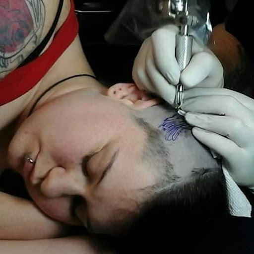 Explore the walking dead tattoo ideas, creative tattoo ideas in Vinton, available at Cherry Bomb Tattoo and piercing