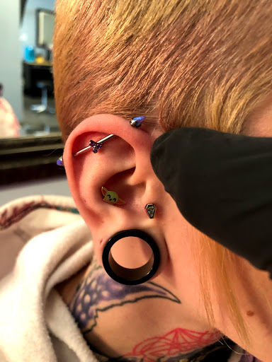 Explore lower belly tattoo ideas, creative tattoo ideas in Palm Harbor, available at Angry Owl Tattoo and Piercing