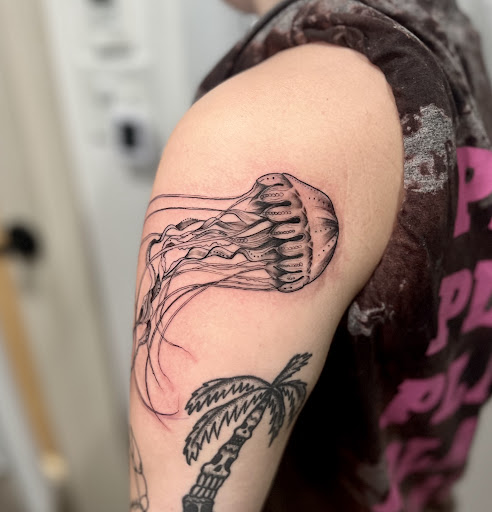 Explore emperor's new groove tattoo ideas, creative tattoo ideas in Wilmington, available at Rogue Tattoo Studio