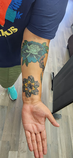 Explore female arm sleeve tattoo ideas, creative tattoo ideas in Riverside, available at Darkstar Tattoo CA