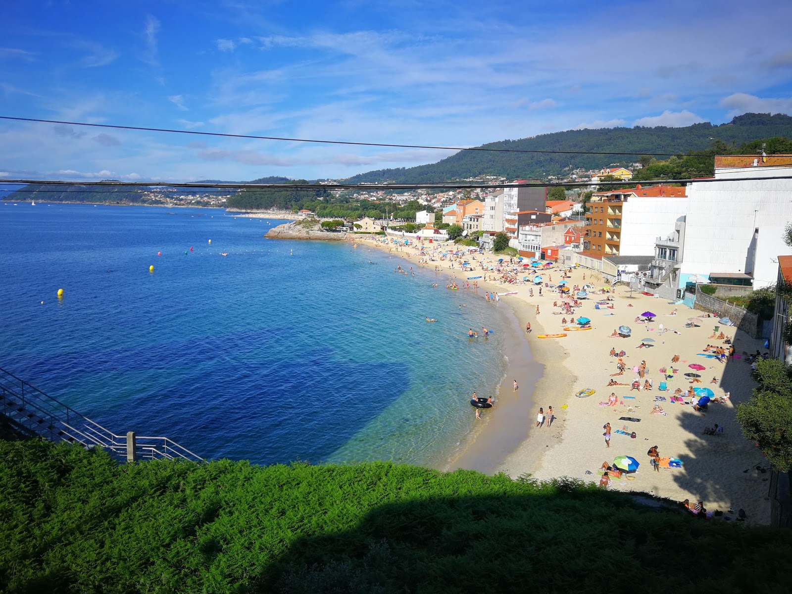 Foto av Praia de Agrelo med turkos rent vatten yta