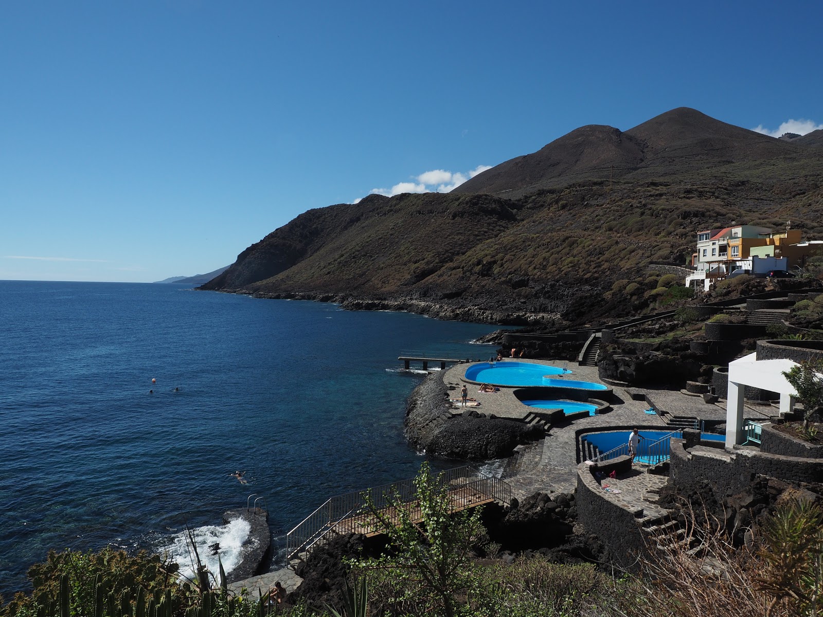 Photo of La Caleta Pools surrounded by mountains