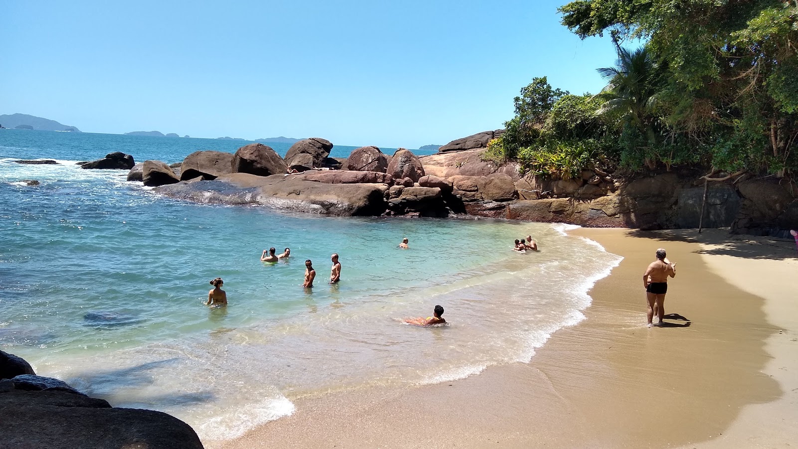 Foto de Praia Portuguesa com água cristalina superfície
