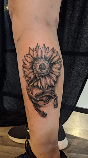 Explore feather memorial tattoo ideas, creative tattoo ideas in Mc Kees Rocks, available at Exile Ink
