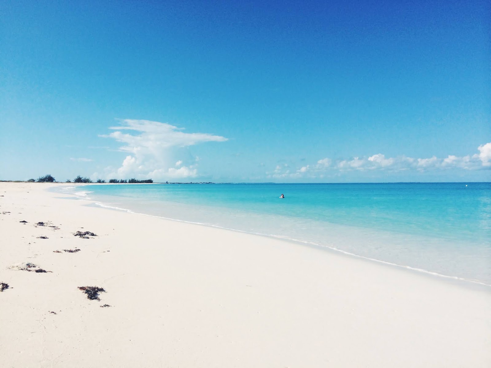 Photo of Pine Cay beach with turquoise pure water surface