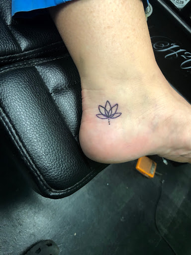Explore fine line spine tattoo ideas, creative tattoo ideas in Meridian, available at Creative Pain Tattoo Studio