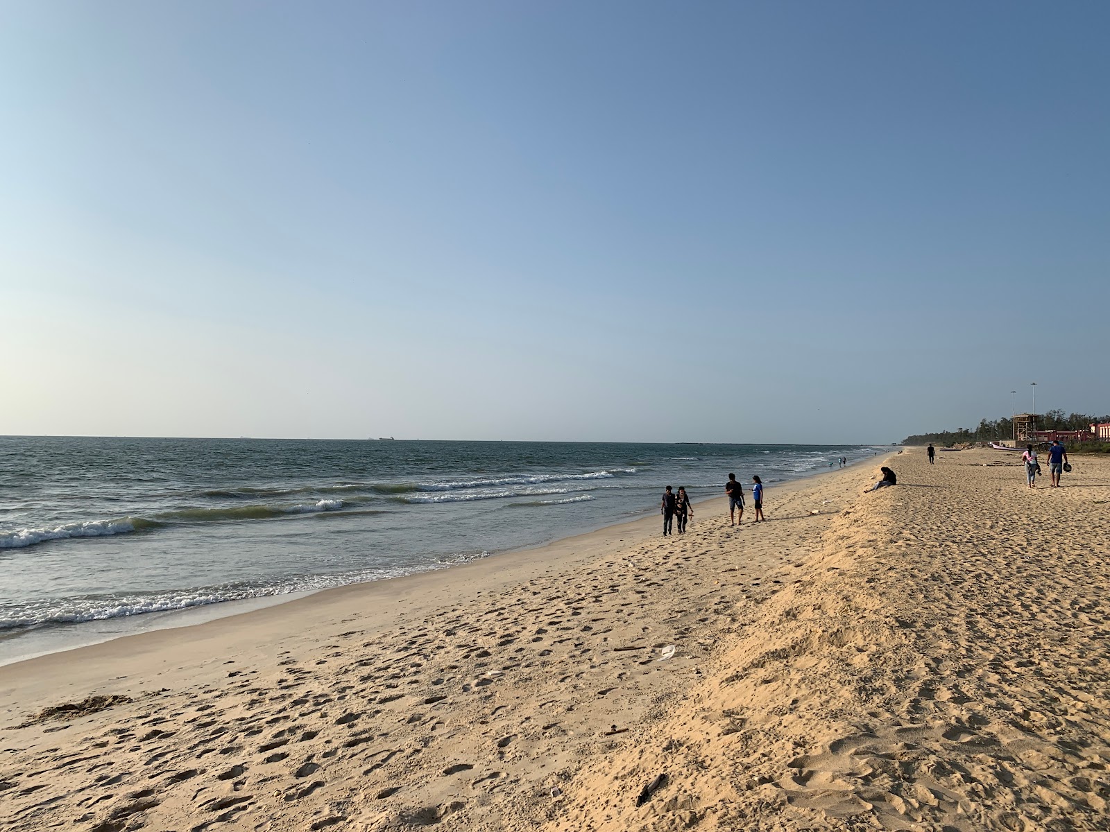 Foto de Tannir Bavi Beach con arena brillante superficie