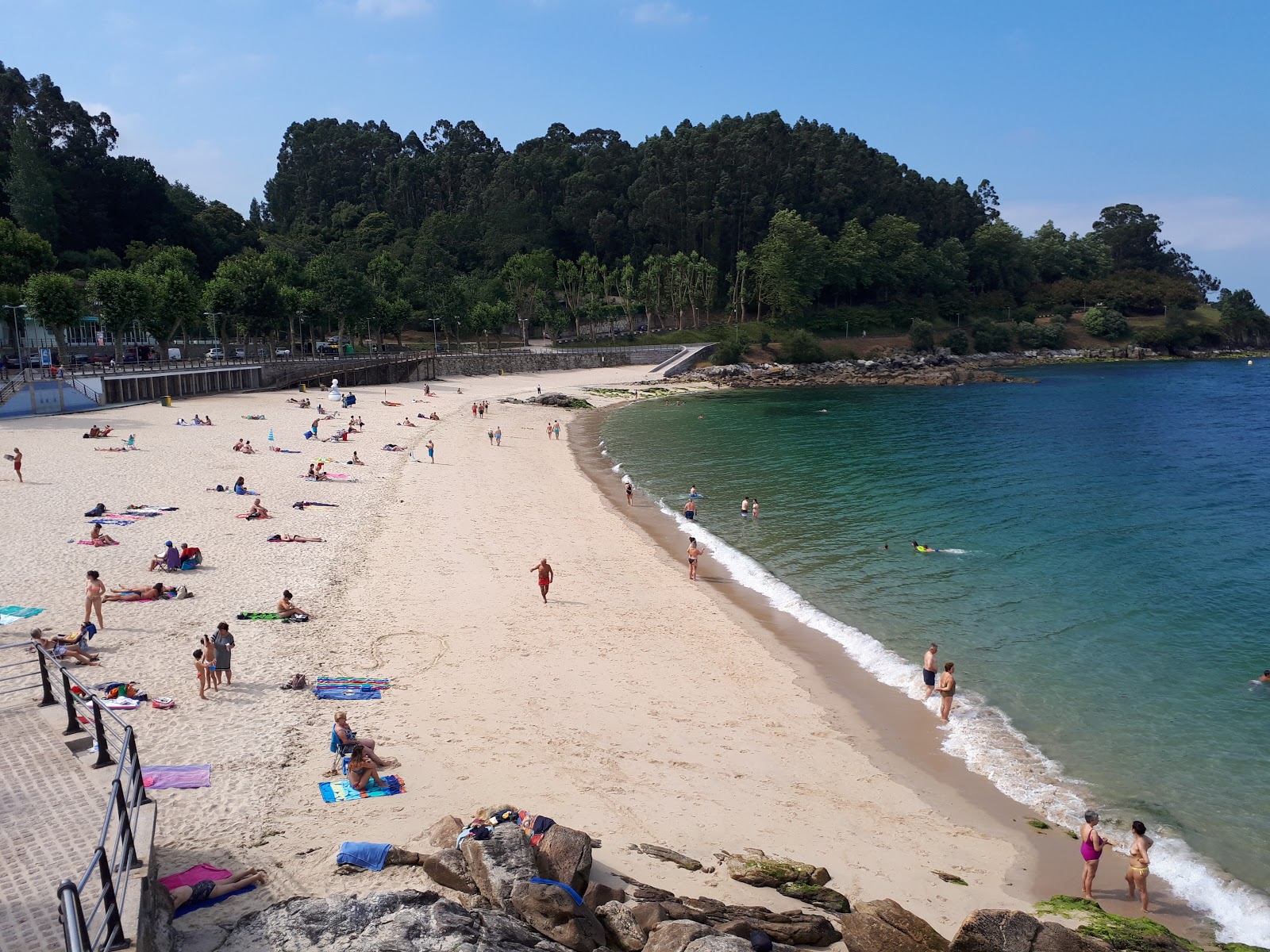 Foto di Praia de Portocelo con una superficie del sabbia bianca