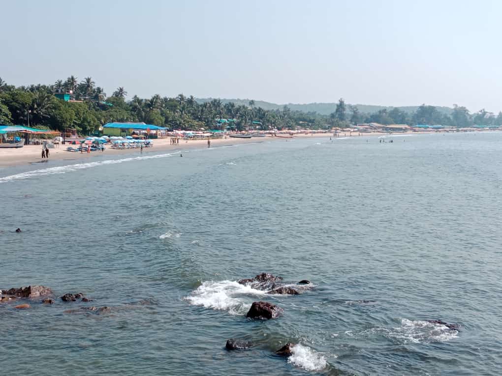 Photo of Arambol Beach backed by cliffs