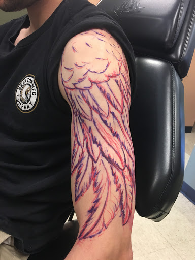 Explore traditional hand tattoo ideas, creative tattoo ideas in Fargo, available at Golden Dragon Tattoo