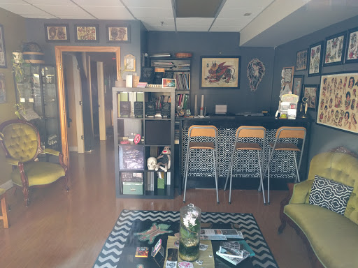 Explore red ink tattoo ideas for guys, creative tattoo ideas in Portsmouth, available at Grim North Tattoo and Piercing