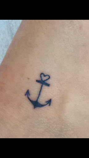 Explore black female tattoos ideas, creative tattoo ideas in Fresno, available at Resistance Tattoo