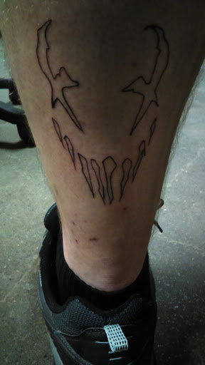 Explore dead dog tattoo ideas, creative tattoo ideas in Lima, available at White Wizard Tattoo & Body Piercing