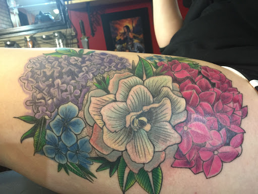 Explore tattoo ideas for new dads, creative tattoo ideas in Dover, available at Walls of Wonder Tattoo And Body Piercing