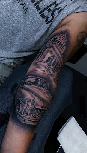 Explore guitar pick tattoo ideas, creative tattoo ideas in East Stroudsburg, available at Faimeouz Ink