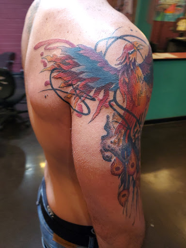 Explore belly button tattoo ideas, creative tattoo ideas in San Diego, available at Sideshow Tattoo and Piercing