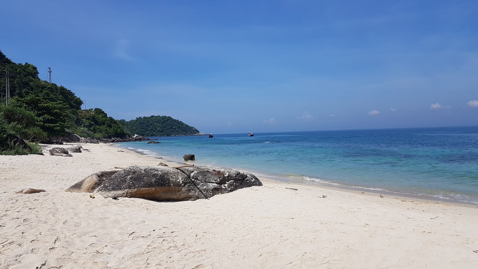 Foto di Koko Beach con una superficie del sabbia beige