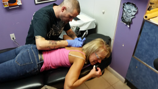 Find low back tattoo ideas for your next unique tattoo in Owosso at Expressions Body Art Studio