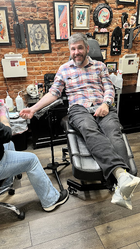 Explore solar eclipse tattoo ideas, creative tattoo ideas in Dubuque, available at The Crows Nest