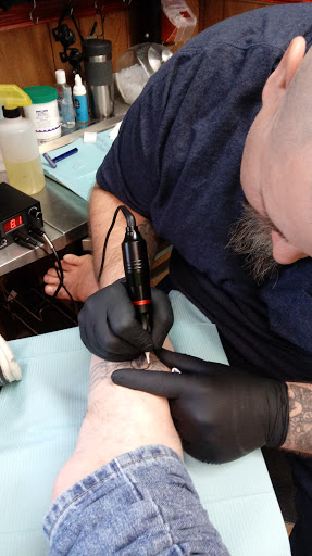 Explore fish tattoo ideas for men, creative tattoo ideas in Etters, available at Twisted Mad Hatter tattoo