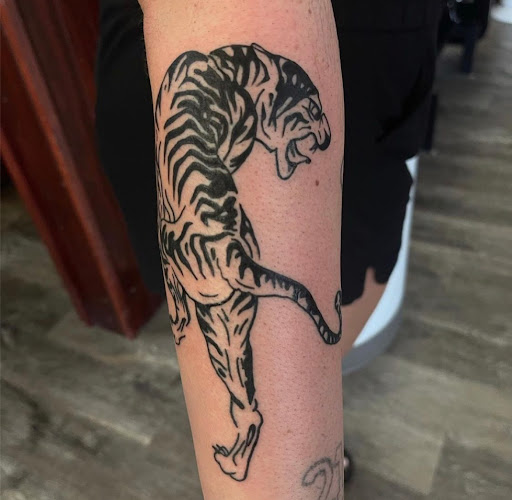 Explore protector tattoo ideas, creative tattoo ideas in Clinton, available at Black Relic Tattoo