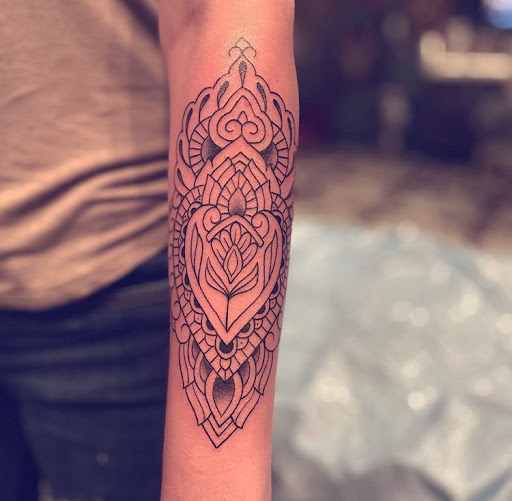 Explore simple silver lining tattoo ideas, creative tattoo ideas in Junction City, available at New Era Tattoo Studio